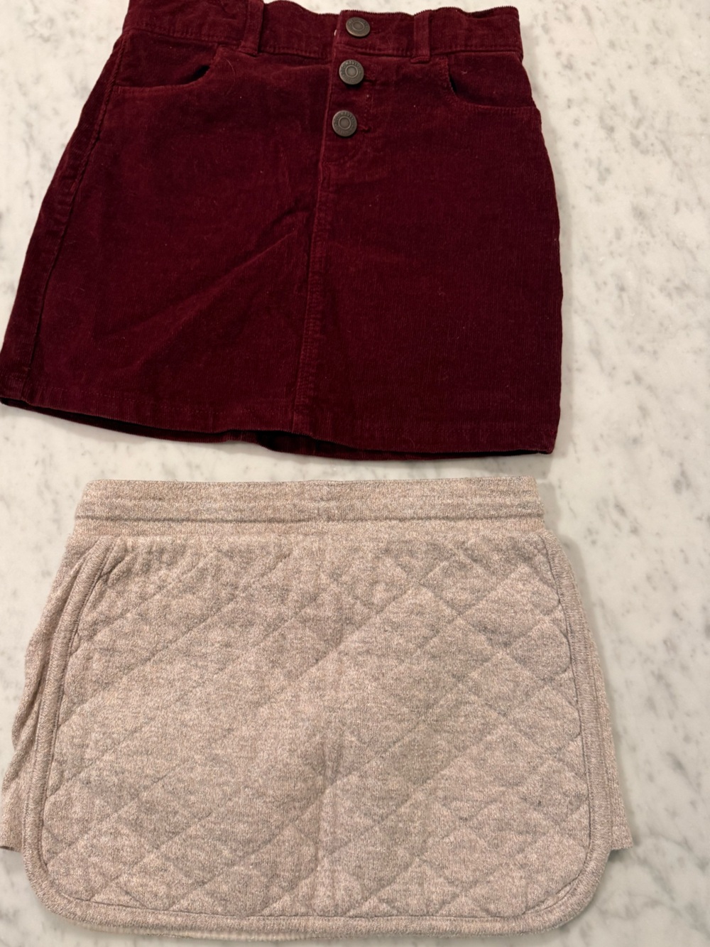 Girls skirts in Burgundy corduroy (ON 6) and Quilted cream (Crewcuts 5/6)